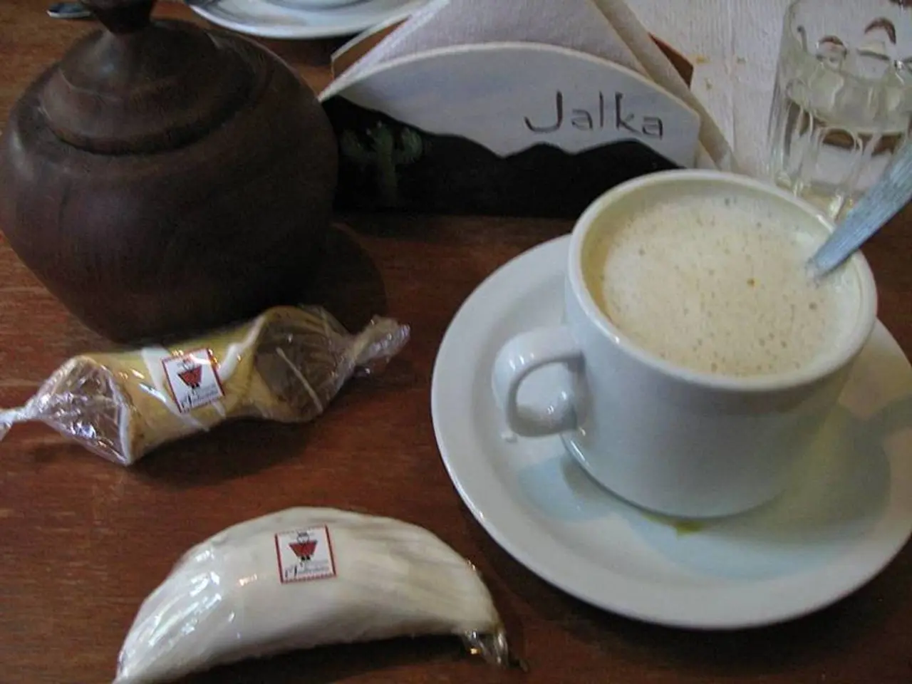 This is milk in a white color cup and saucer. These are the tissues in the middle of an image.