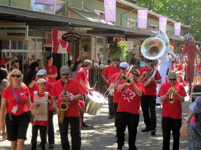In this image we can see this people are playing musical instruments on the road. In the background...