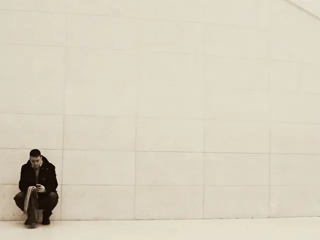 In this image, we can see a person is in a squat position and holding some objects. At the bottom,...