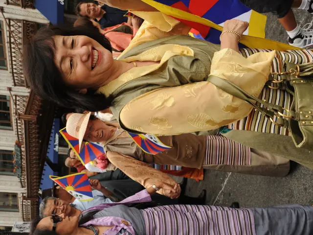 In this image there are group of people standing and some of them are wearing bags and some of them...