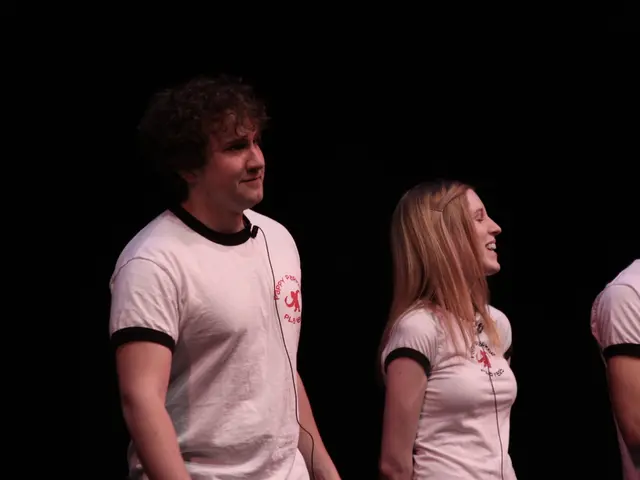 There are three persons standing and wore t shirts.